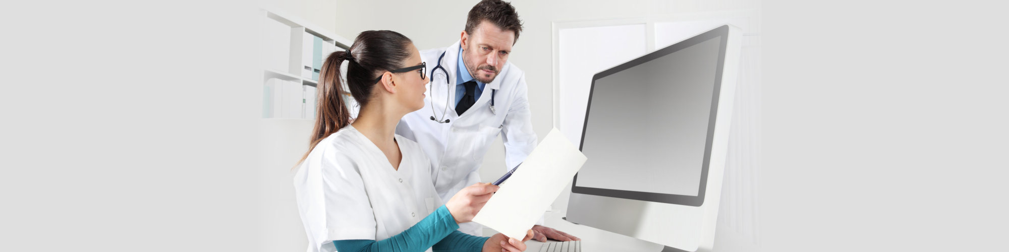 Doctors with nurse looking medical records, concept of consult